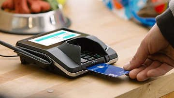 card-linked-services-360x202 Person using Visa chip card at a chip-enabled terminal.