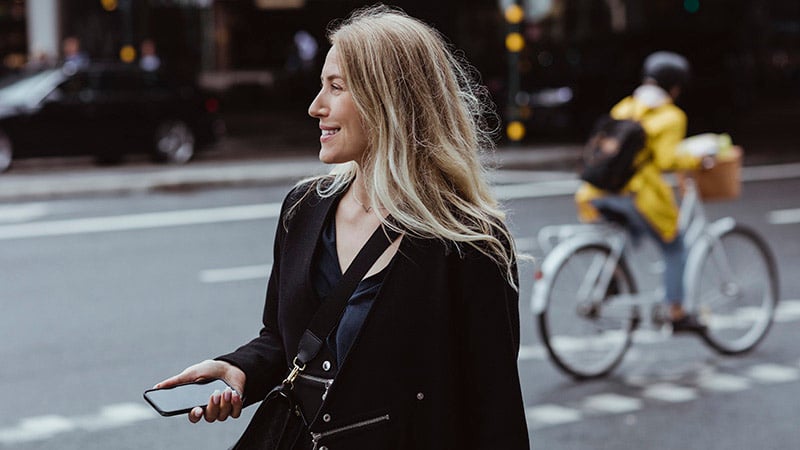 Smiling woman with phone