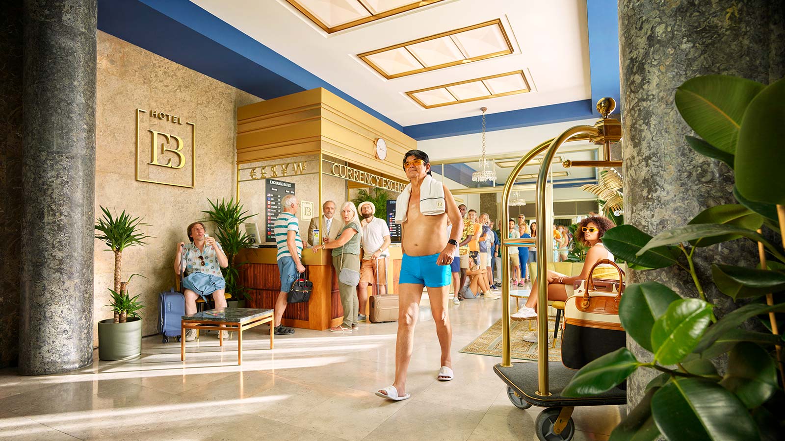 man on holiday walking through a hotel reception